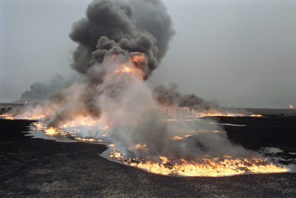 Infrastructural and Environmental Damage during Iraqi Occupation of Kuwait
Oil fields set ablaze by Iraqi occupation forces in Al-Maqwa.
Photo ID 1410. 25/03/1991. Al-Maqwa, Kuwait. UN Photo/John Isaac.